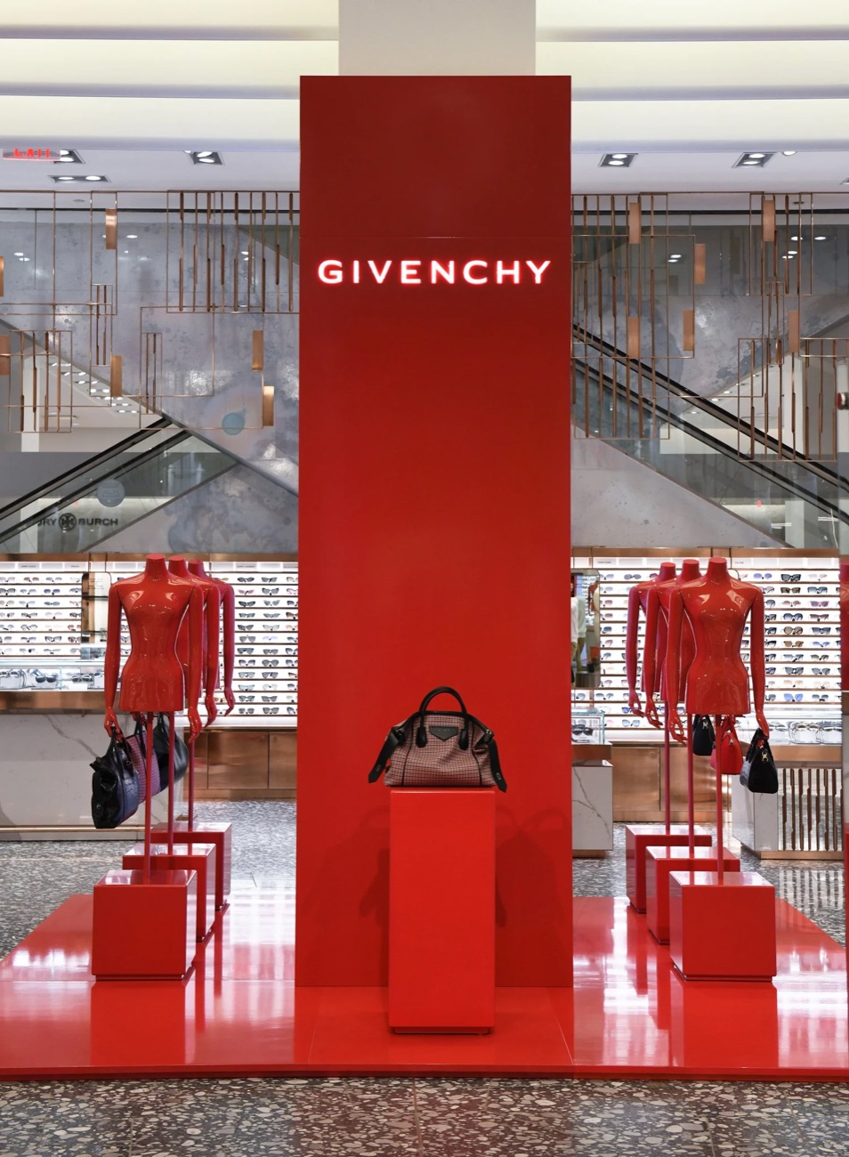 Givenchy retail activation with red display and mannequins